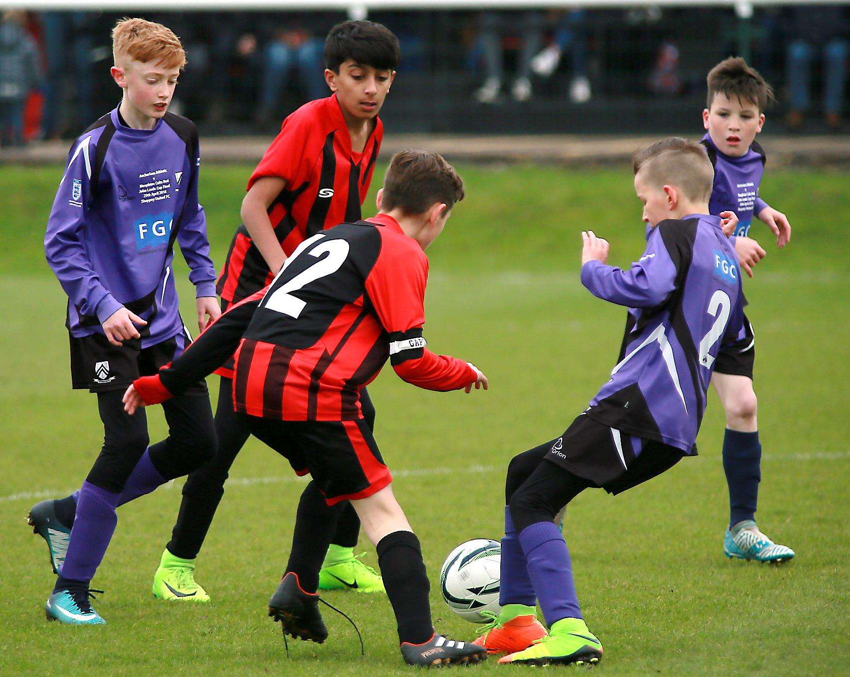 Action from the Under-12 John Leeds Trophy final as Meopham Colts Red face Anchorians Athletic. Picture: Phil Lee FM1660353