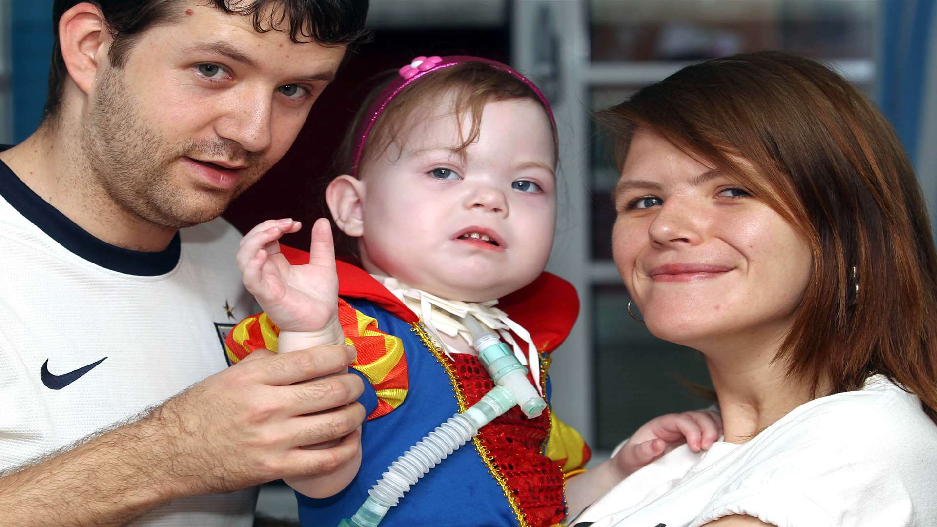 Maisie Harris with her parents Andrew Harris and Rachel Bridger at Great Ormond Street Hospital