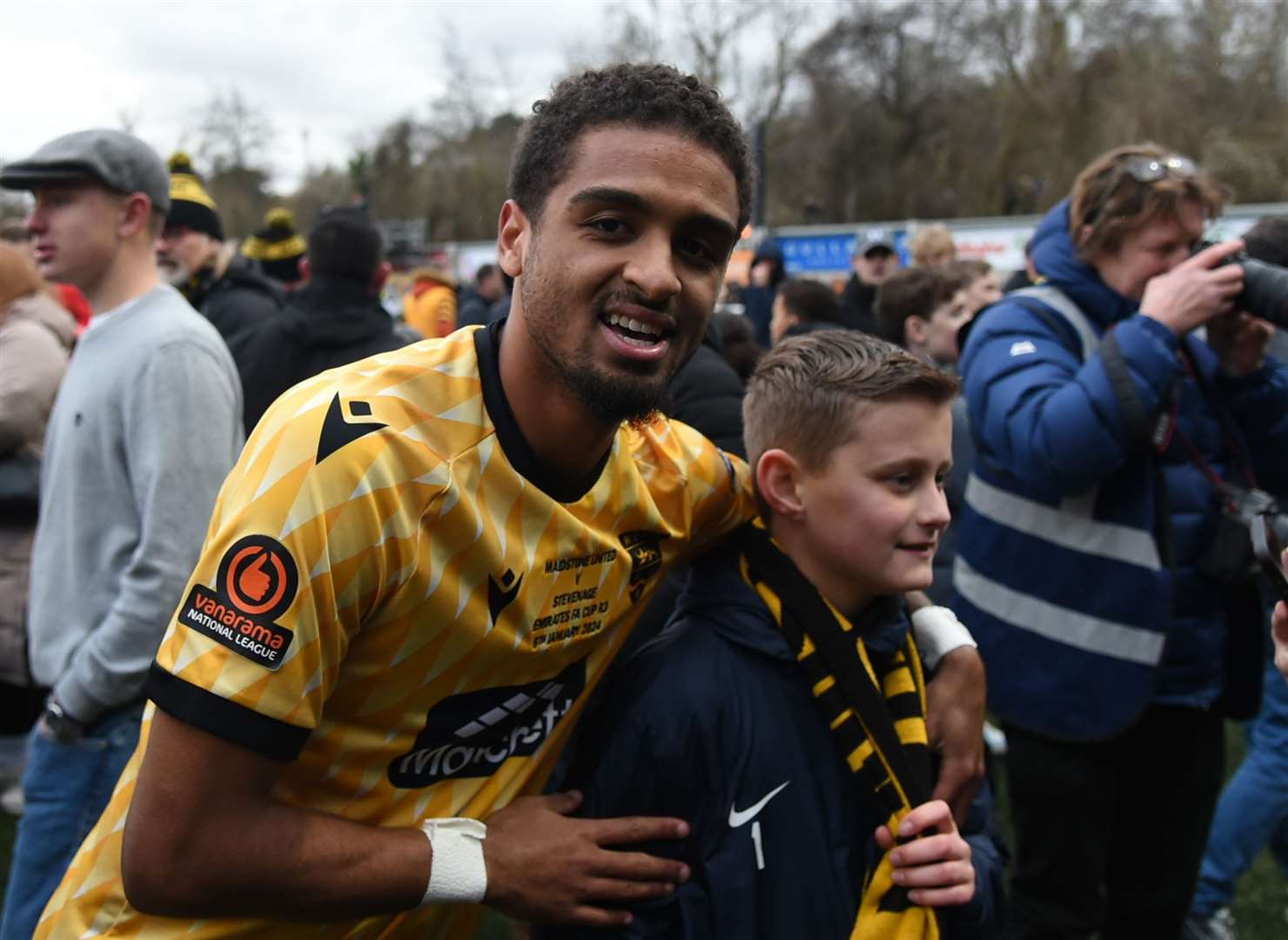 Maidstone winger Liam Sole celebrates with fans after beating Stevenage. Picture: Steve Terrell