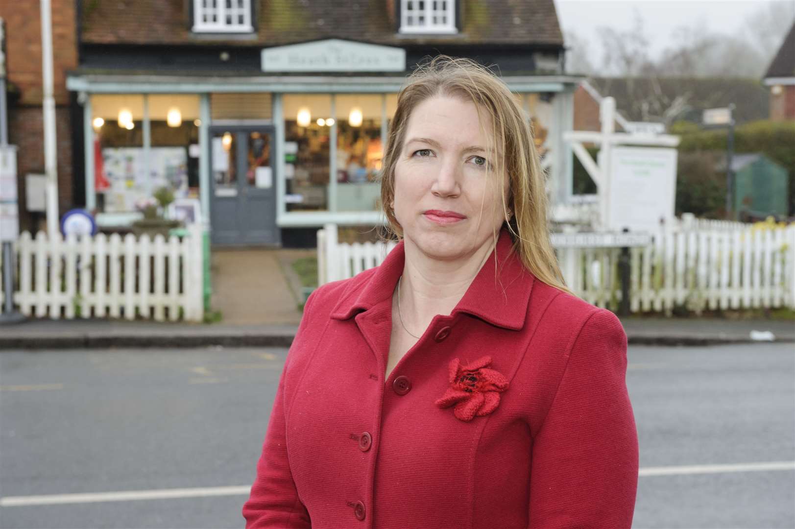 Kate Mills, with The Heath Stores behind