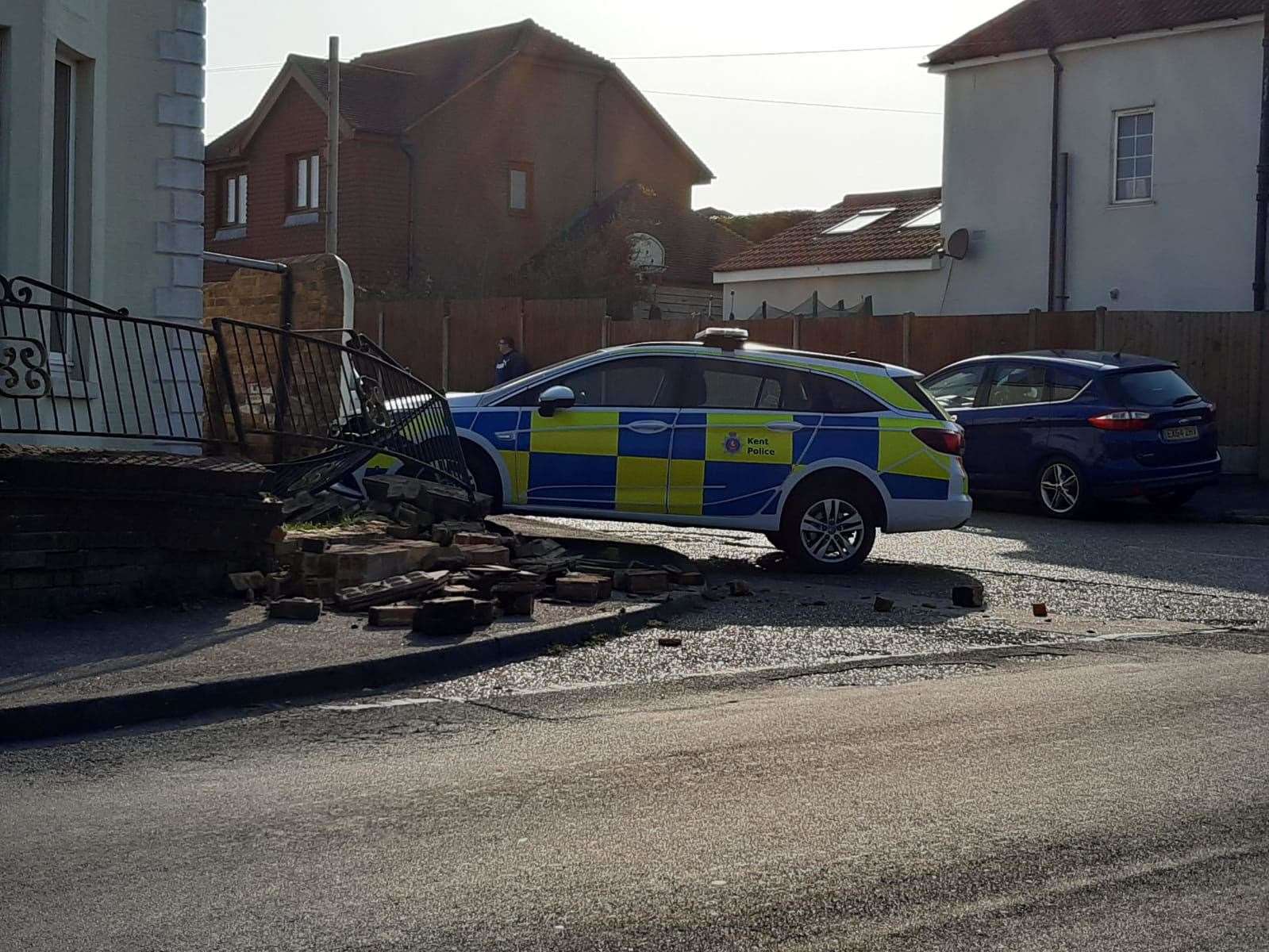 The police car crashed into a wall at about 5.25pm on Sunday