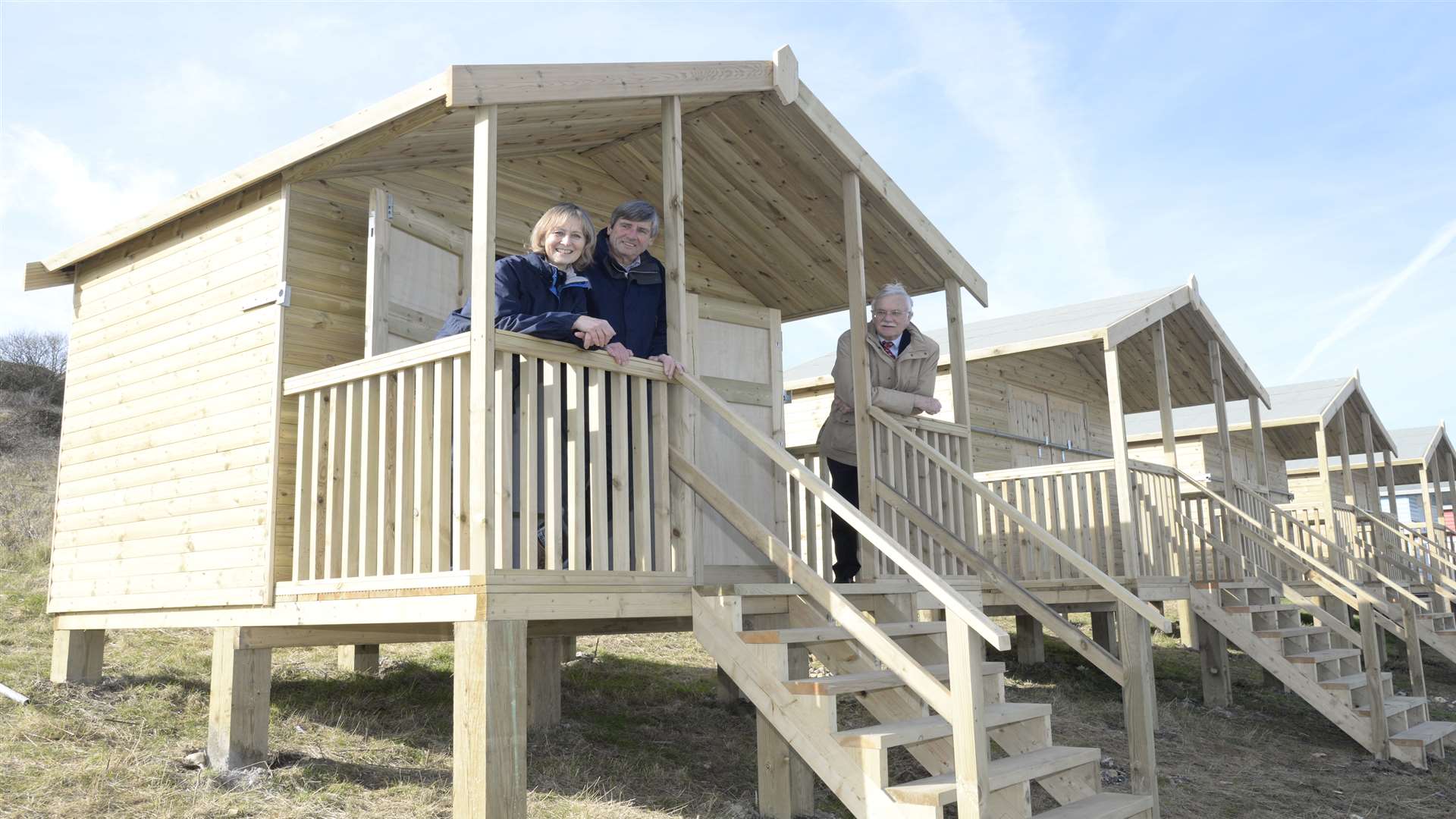 Colin and Barbara McLeod at their new beach hut at Minster with Cllr Mike Cosgrove