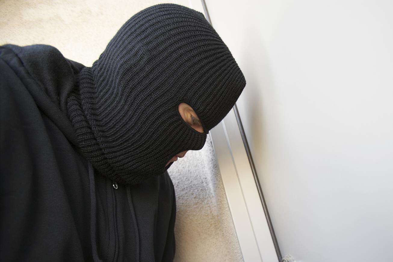 The pensioners found masked intruders burgling their home. Stock image
