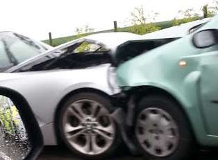 A crash involving a silver BMW and green Fiat Punto