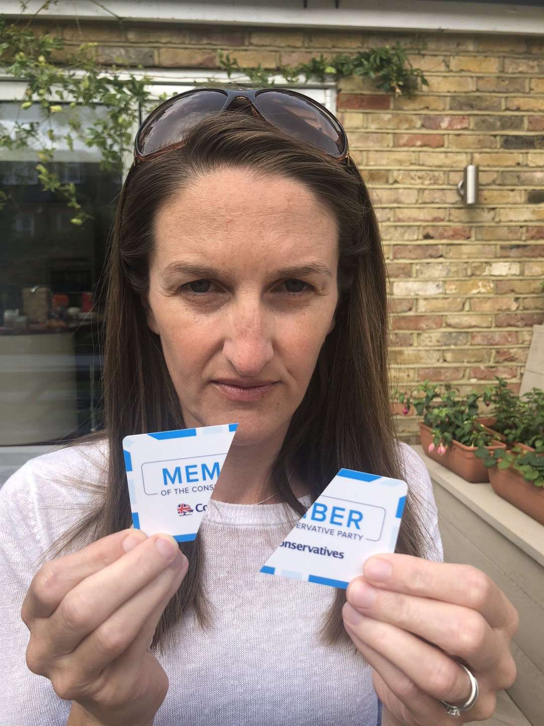 Dominey Jenner, 42, is one of multiple Conservative Party members to have cut up their membership cards in protest at Boris Johnson’s move to make face masks mandatory in shops in England (Dominey Jenner/PA)