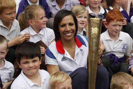 Dame Kelly Holmes with the Olympic torch at Tonbridge Casle. Picture: Matthew Walker