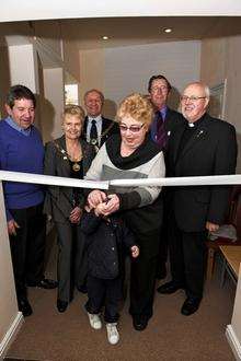 Opening the centre are Brian Lyons’ great-grandson Harry Thompson, four, and widow Barbara Lyons, with back, from left, Gordon Henderson MP mayoress of Swale Sylvia Bennett, mayor Ben Stokes, Jo Gunnell of SSAFA Kent and Fr Barry Birch