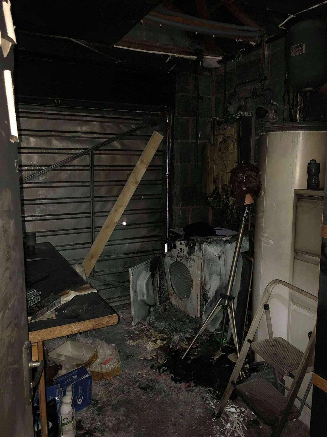 The fire started in a garage attached to the salon