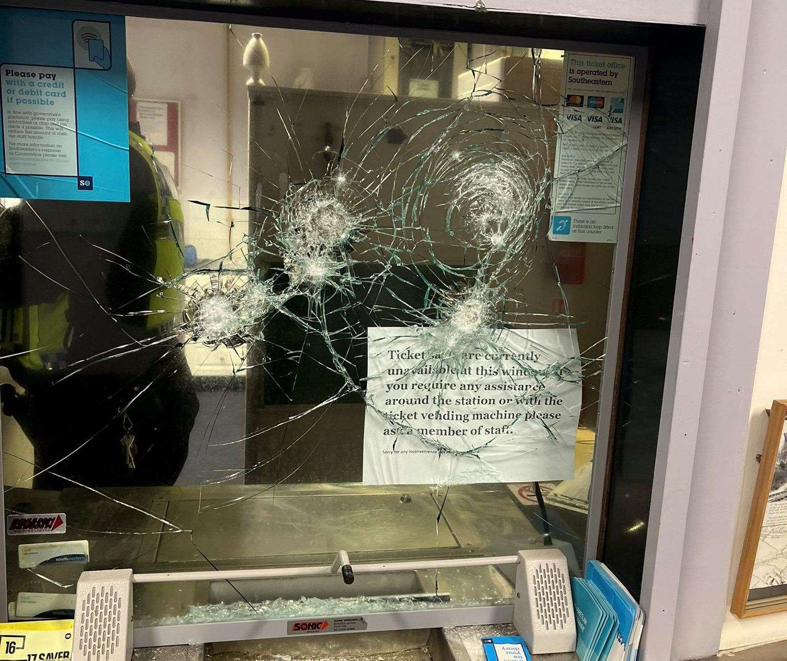 The ticket office window was smashed during the incident. Picture: BTP