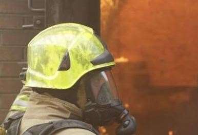 Firefighter wearing breathing apparatus (stock photo)