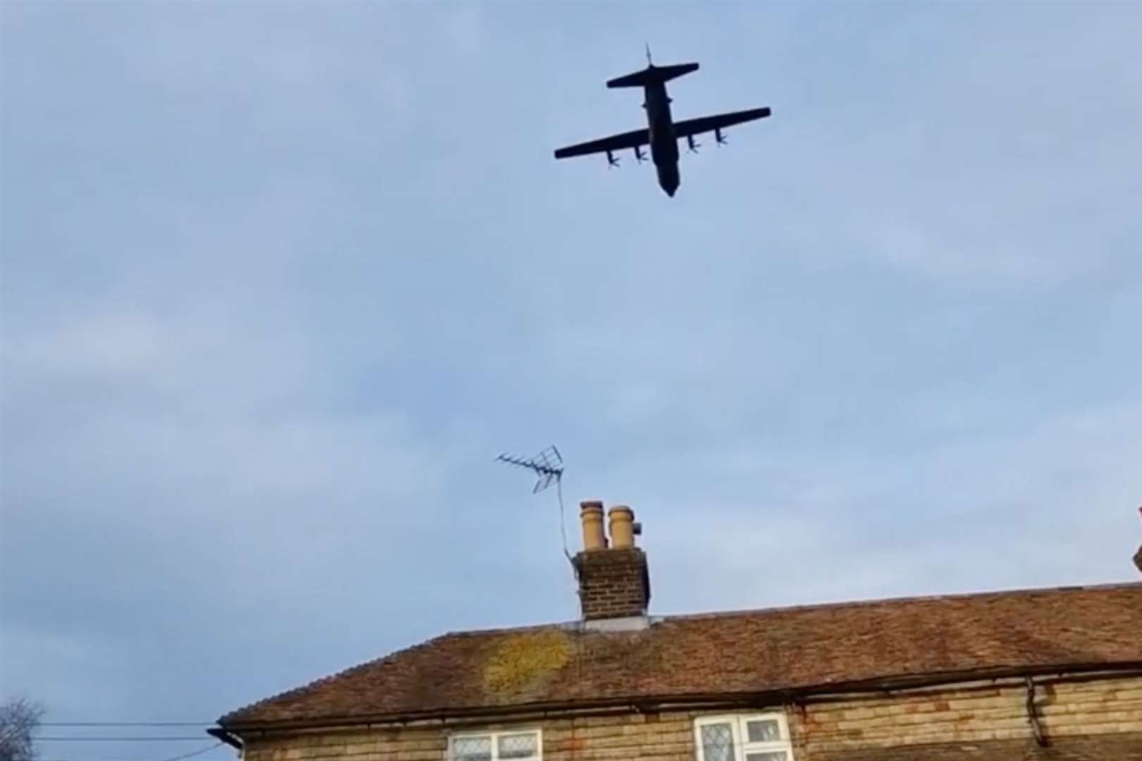 A Lockheed Hercules flies low over houses in Mersham, near Ashford. Picture: Duncan Armstrong