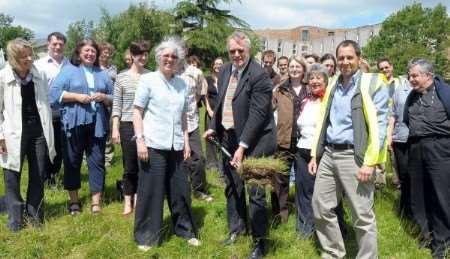 David Nightingale, senior deputy vice-chancellor of the University of Kent, lifts the first sod at a ceremony to mark the start of work on the labyrinth