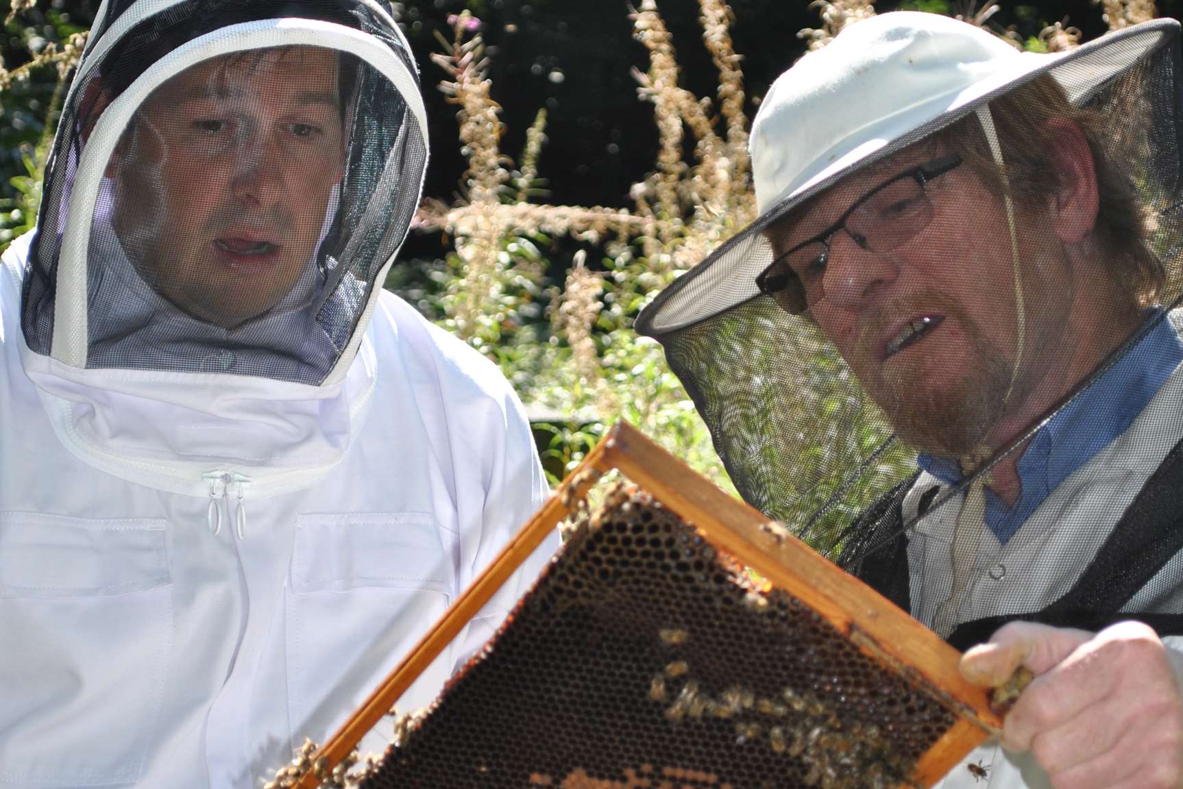 Keven Gabriel with beekeeper John Holmes