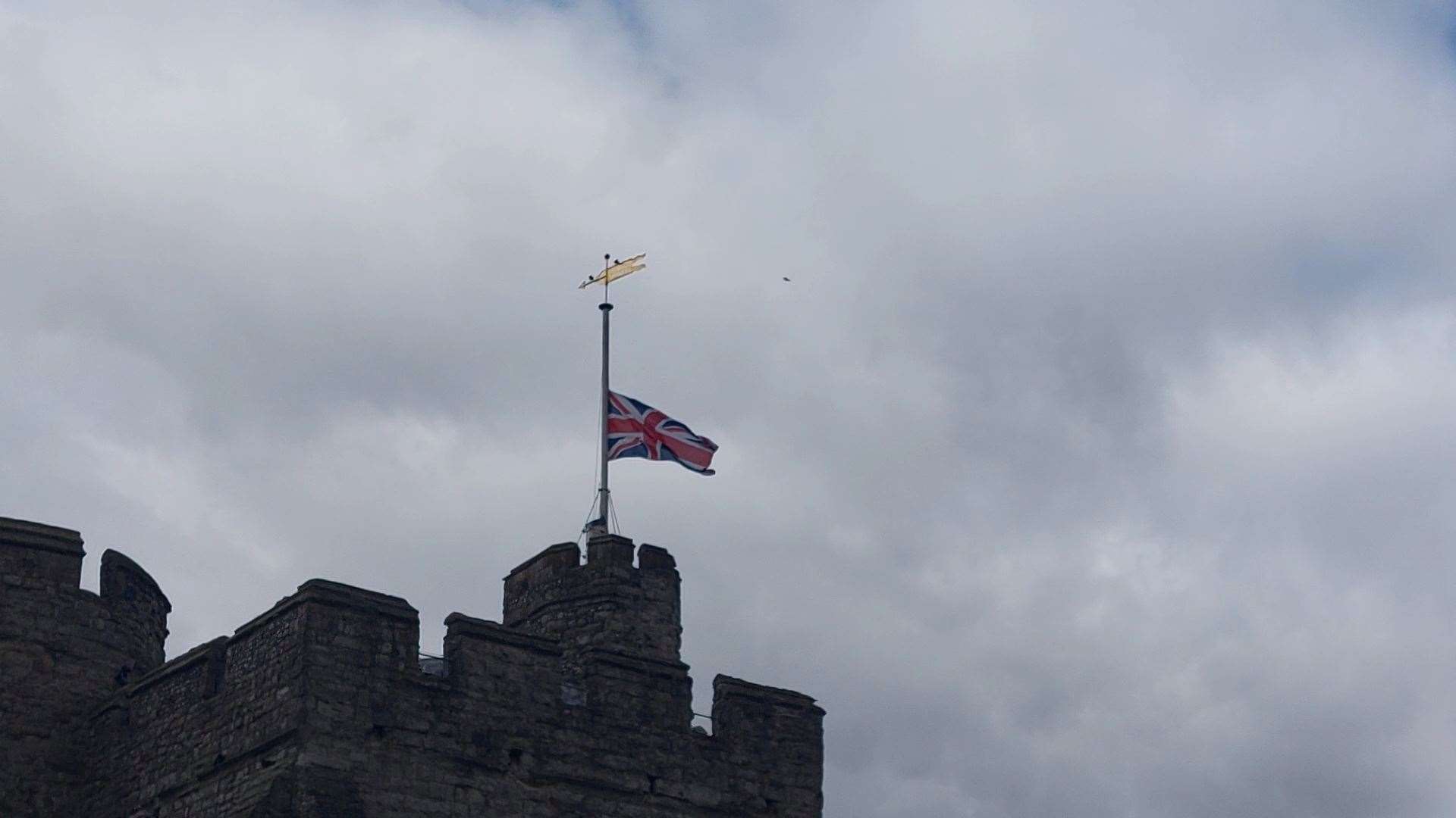 A flag flying at half-mast at Westgate Towers in Canterbury