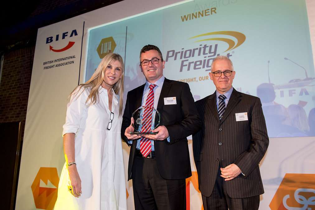 Olympic swimmer and TV presenter Sharron Davies presents the award to Neal Williams of Priority Freight, centre, with sponsor Nigel Smith of Forward Computers