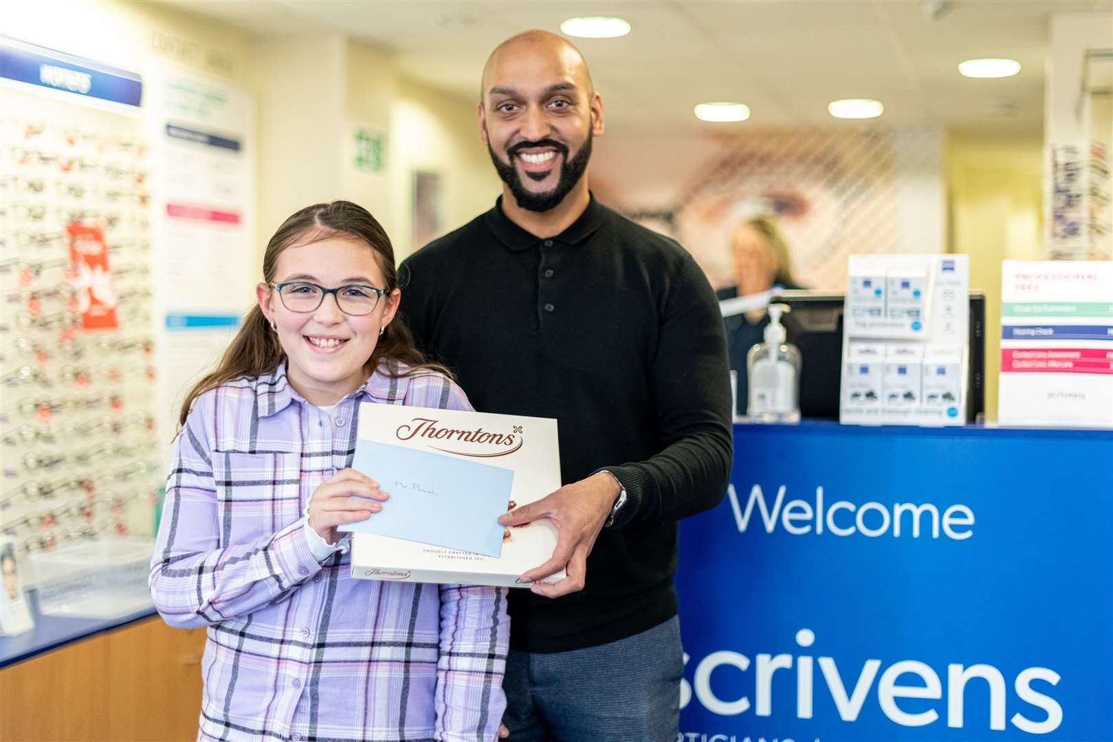 Poppy-May Leeds brought her optometrist Mrudang Patel at Scrivens, Herne Bay a box of chocolates to say thank you