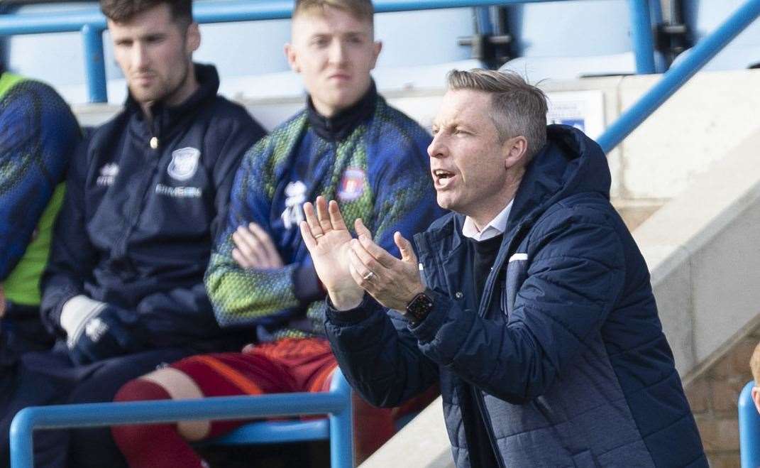 Neil Harris encourages his men from the touchline on Saturday as Gillingham play Carlisle