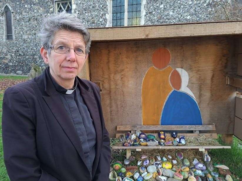 Reverend Jo Richards with the now empty crib outside St Dunstan's church, Canterbury