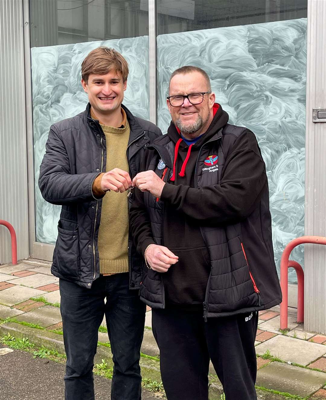 Neil Charlick, chief executive of Gillingham Street Angels(righ) receives keys from Peter Gray, director of Grays of Chatham Used Car Centre