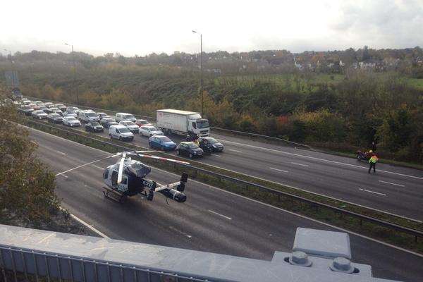 The air ambulance lands on the A2. Picture: Laura Fox