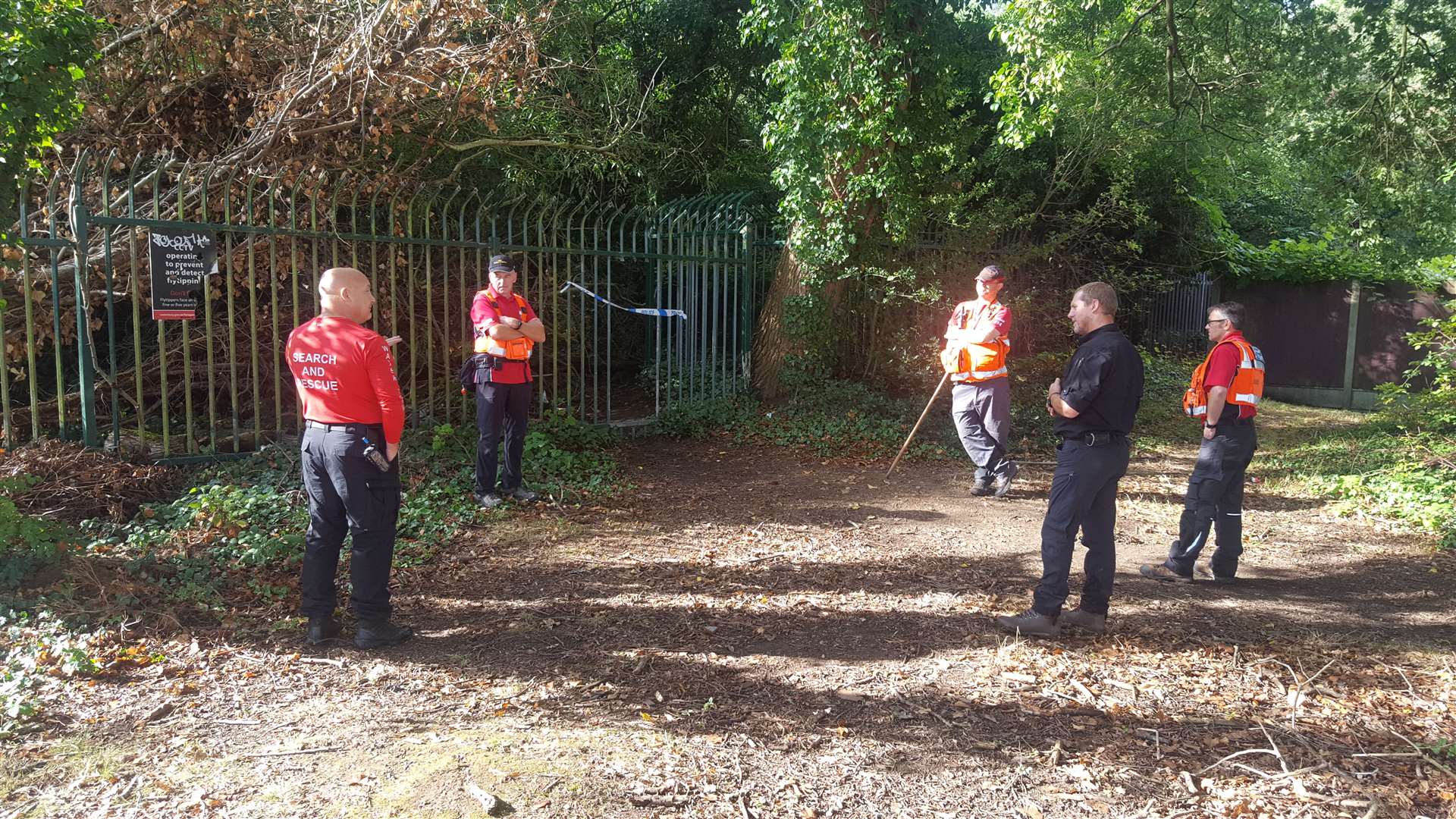Search and rescue teams at an unofficial entrance to Old Park