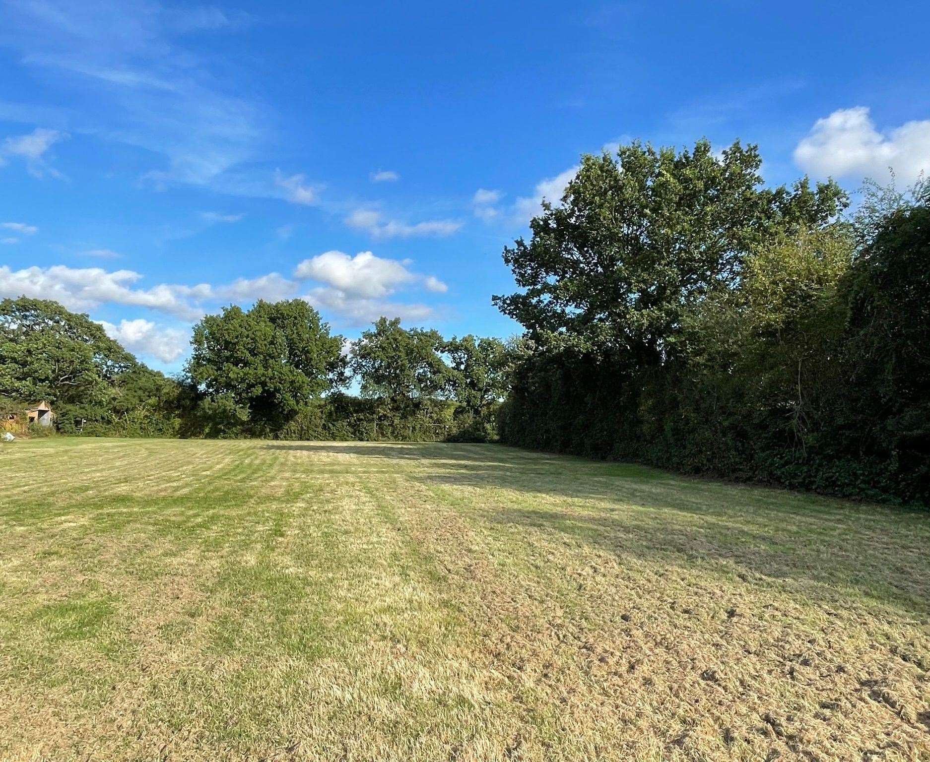 The field at the back of the couple’s property in Tally Ho Road, Shadoxhurst, is currently unused