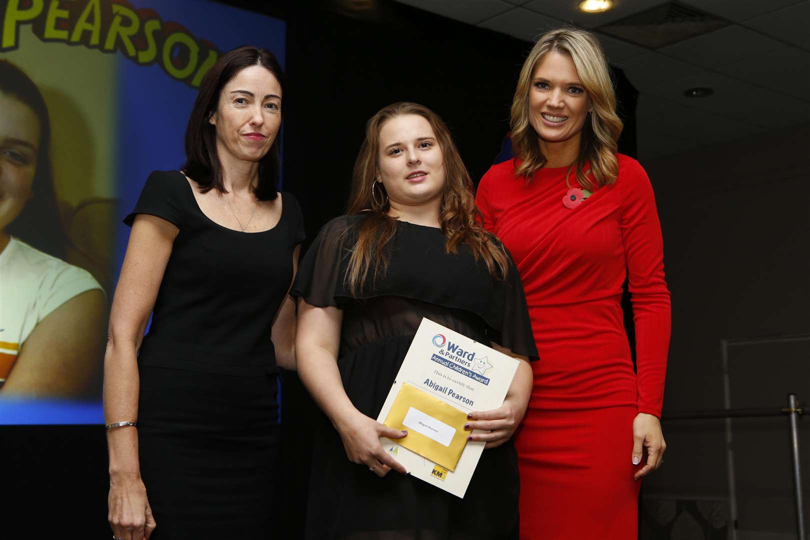 Katrina Newick collecting the award for Exceptional Young Carer on behalf of Abigail Pearson with Senior Operations Director for North Kent Sam Dalton and Charlotte Hawkins. Picture: Andy Jones