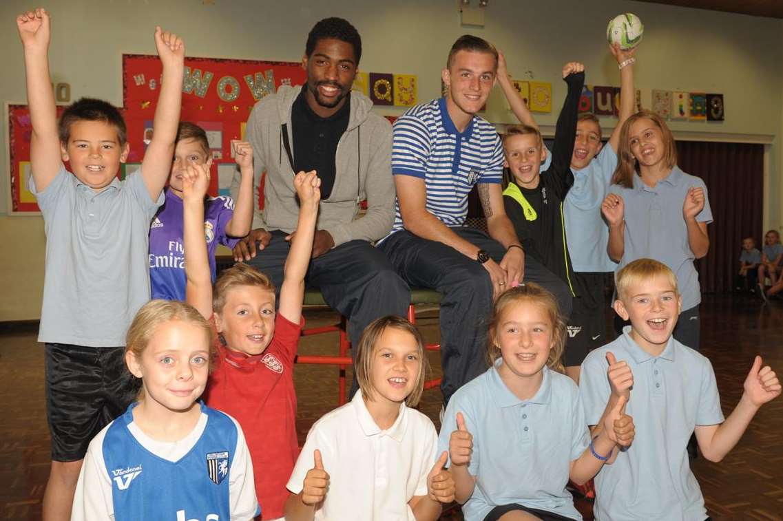 Gills' players Devante McKain and Brennan Dickenson with Halfway Houses Primary School pupils