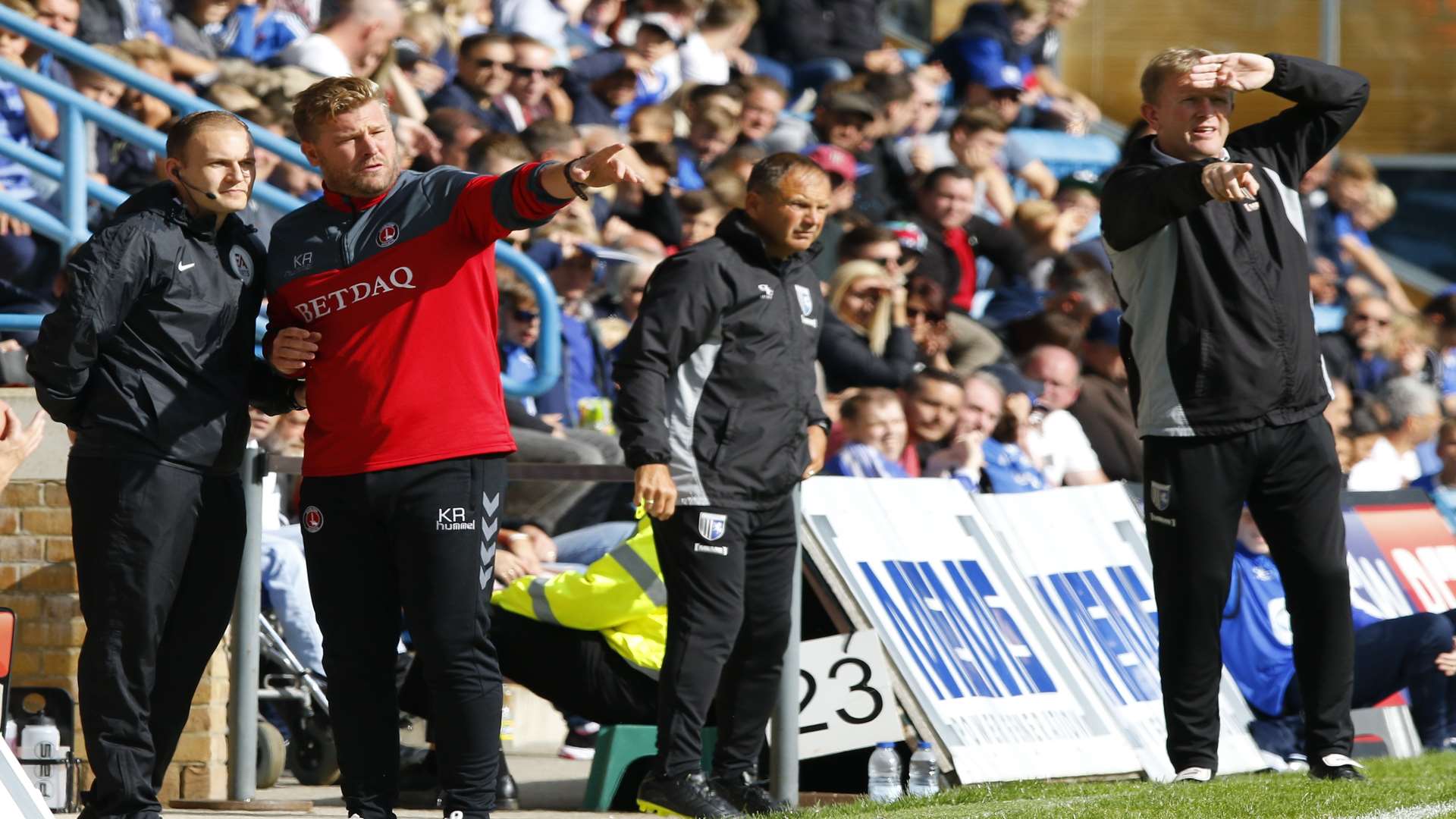 Gills boss Ady Pennock, right, and Charlton manager Karl Robinson, left, on the touchline Picture: Andy Jones