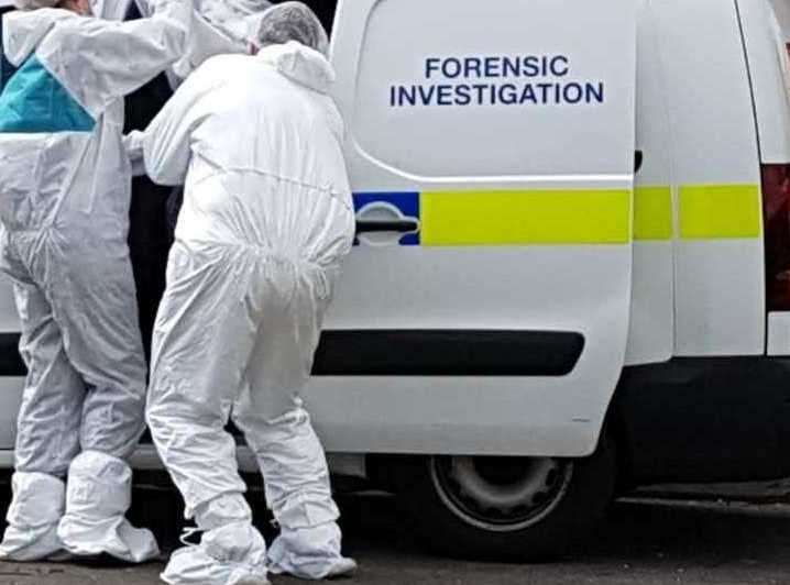 Forensics officers are at the scene Stock picture