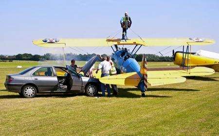 Car jumpstarts a plane. Picture: Howard Marsh