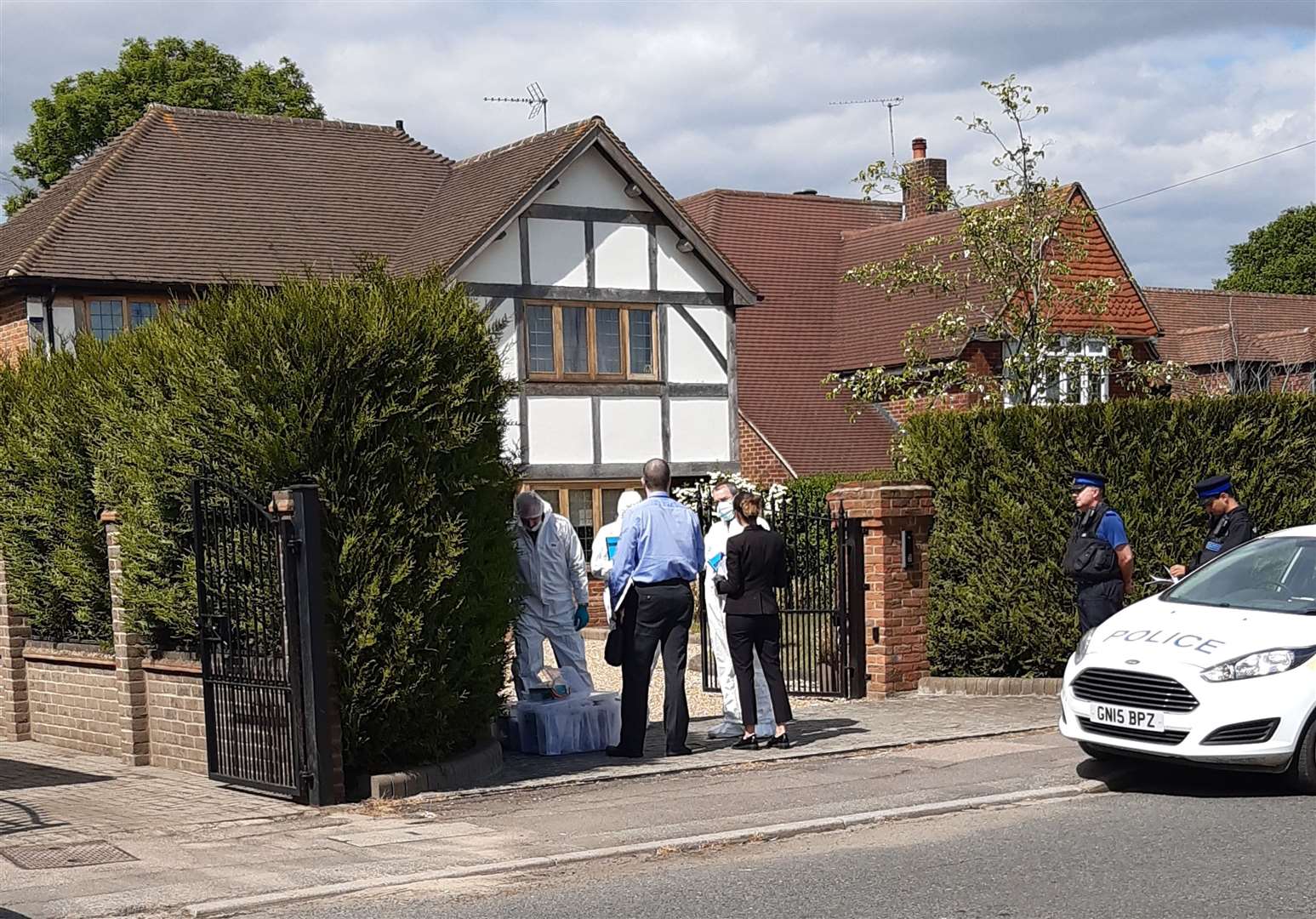 Forensic teams at the house in Oakfield Lane in Dartford where police launched a murder investigation