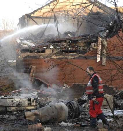 Scene of carnage: An air crash investigator surveys the destruction. Picture: Grant Falvey