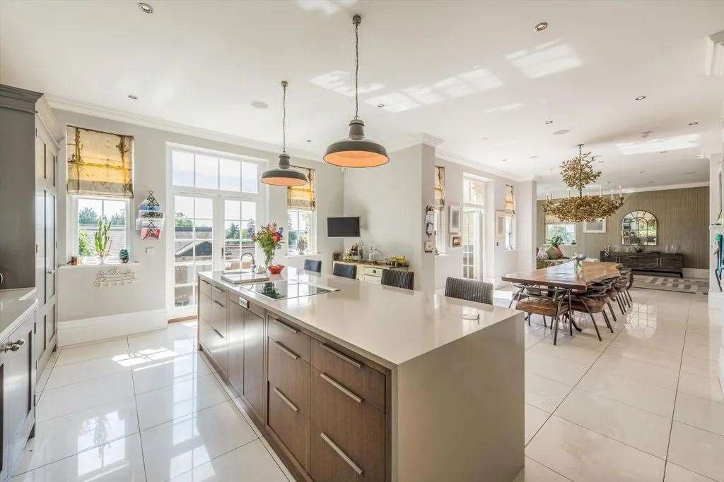 Enjoy breakfast in the open plan kitchen with a view of the garden. Picture: Knight Frank