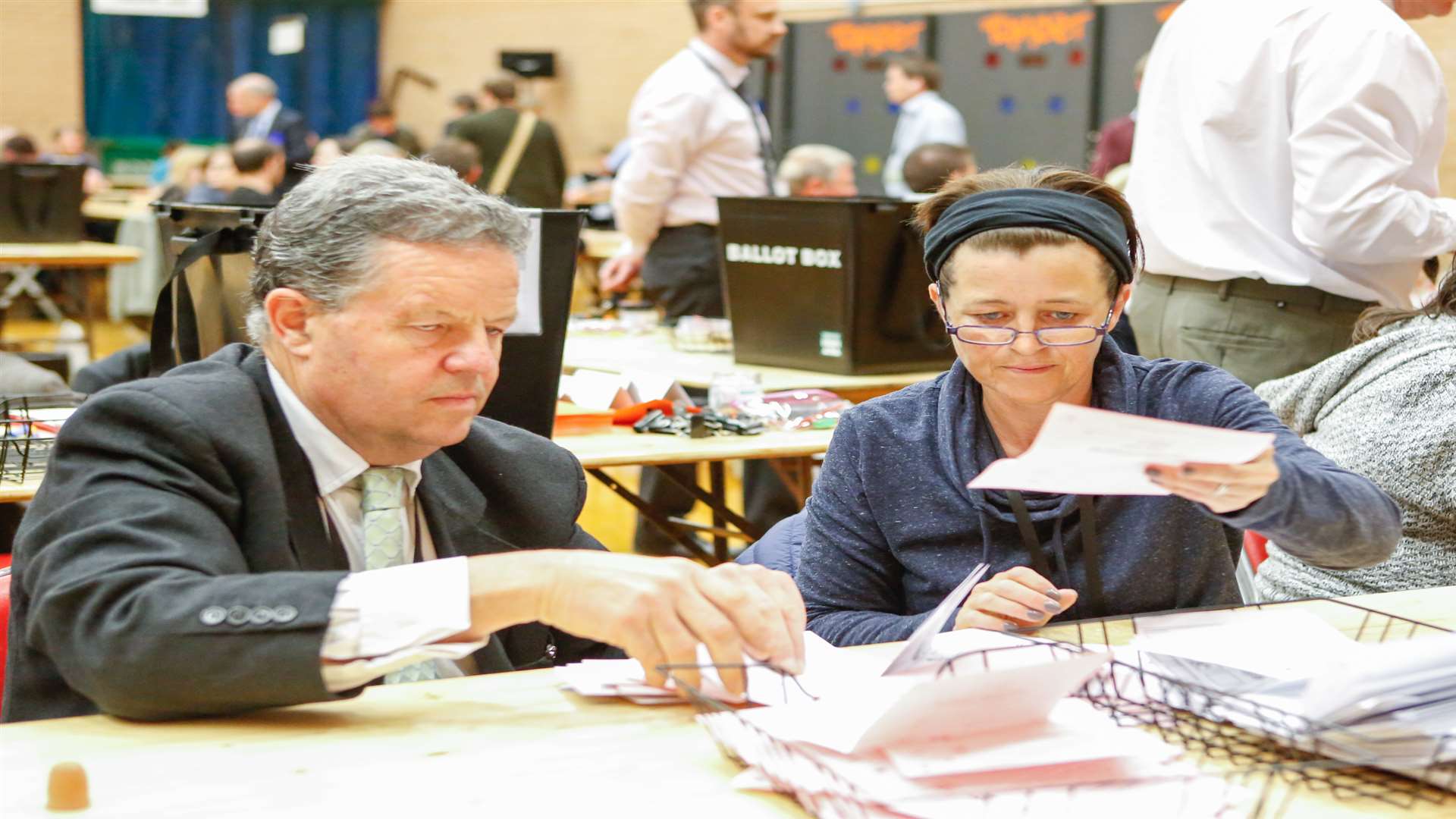 Staff separate out the local election papers from the parliamentary votes. Picture: Matthew Walker