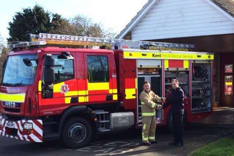 Dymchurch's new fire engine. Crew manager Dan Noonan receiving the keys from KFRS’s firefighting tactics manager, Phil Bailey, this morning.