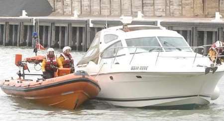 Members of the Whitstable Lifeboat bring the motor cruiser Ocean Drive into the harbour. Picture courtesy RNLI WHITSTABLE