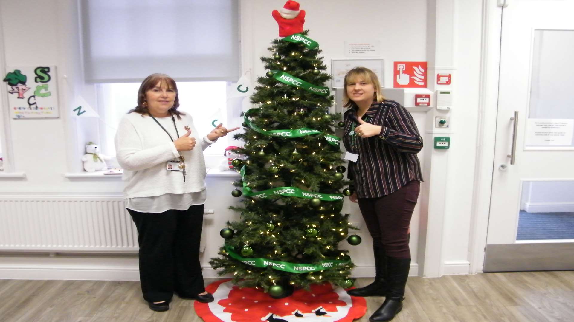 NSPCC staff at the Gillingham centre in West Street with their new tree
