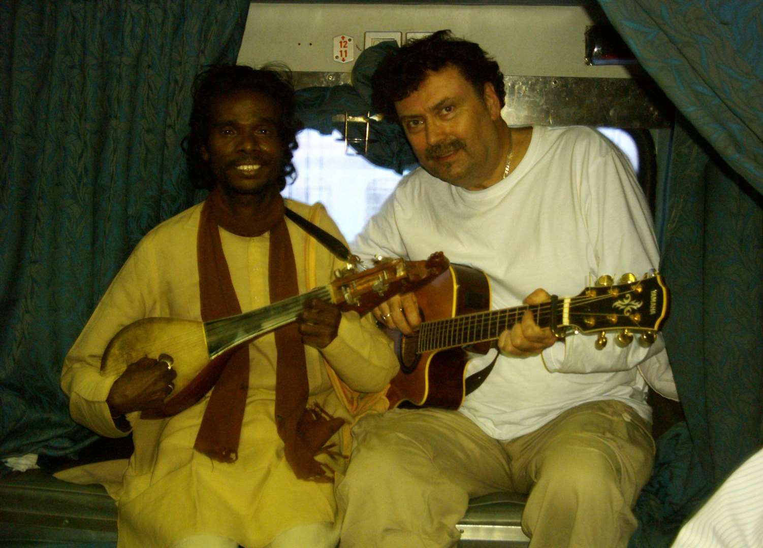 Singing on an Indian train with a Baul singer busker