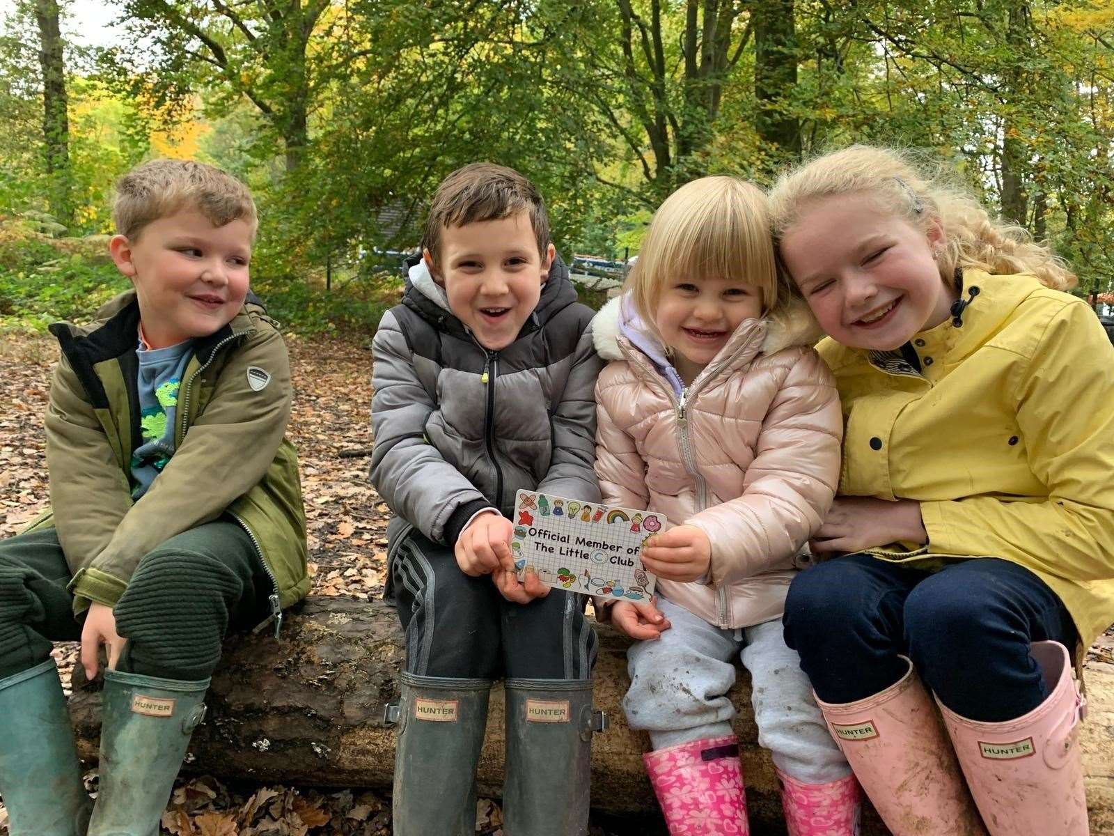 Nic and Jen's children as signed up members of the Little C Club holding the cards their mums created. From left to right: Albie, 5, Dylan, 5, Poppy, 3 and Eliza, 9