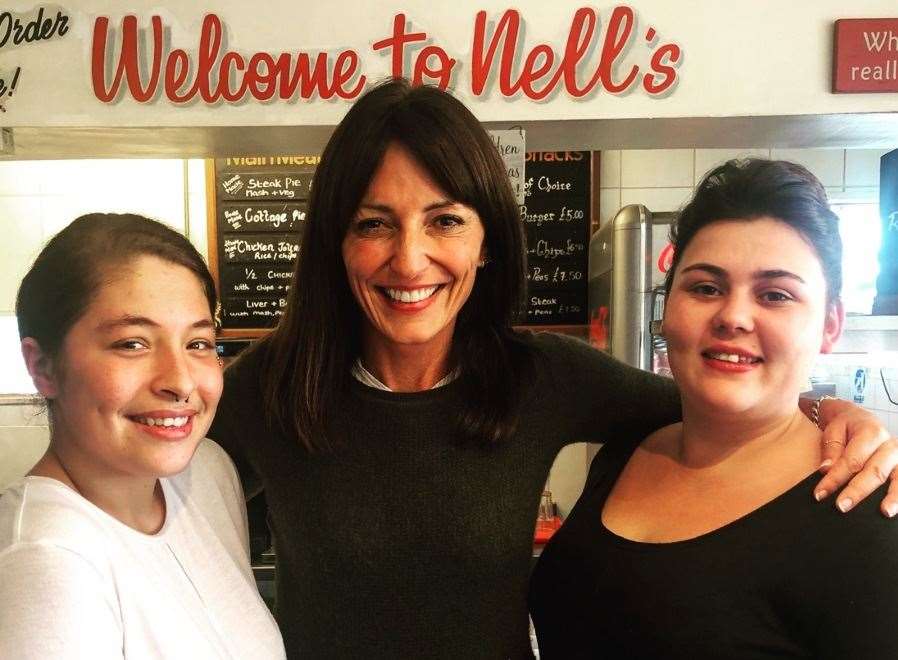 Davina McCall poses for a photo with two staff members at Nell's Cafe