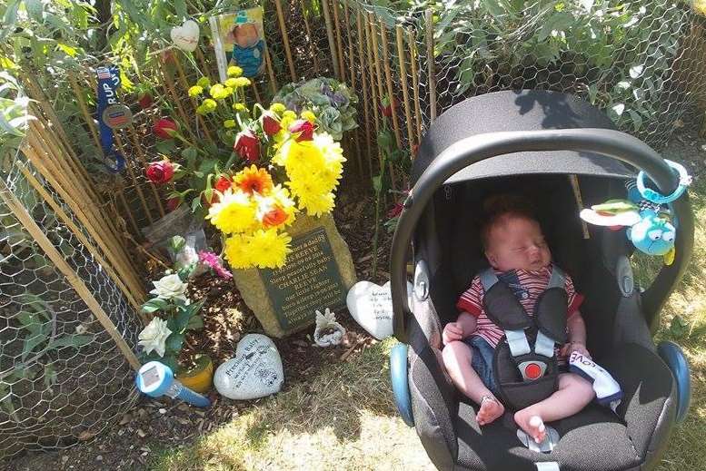 Baby Chris visiting the ashes of his dad and brother Charlie for the first time at The Garden of England Crematorium in Bobbing