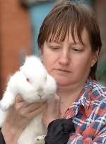 Linzi Aubourg with an abandoned rabbit the animal sanctuary was able to save in 2005. Picture: DAVE DOWNEY