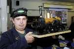 Nigel Pryor displays his wood and paper model of a 1902 locomotive. Picture: Paul Amos