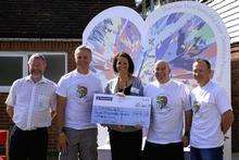 The Biking Turtles present a cheque for £4,000 to Hayley Richardson from Demelza