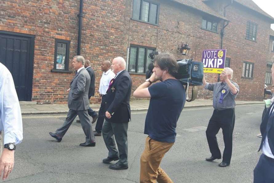 Nigel Farage striding out in Sandwich, shortly before arriving in Thanet.