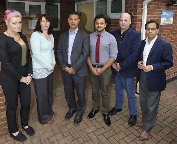 MP Rehman Chishti, right, with doctors, patients and staff outside the Wyvill surgery in Parkwood