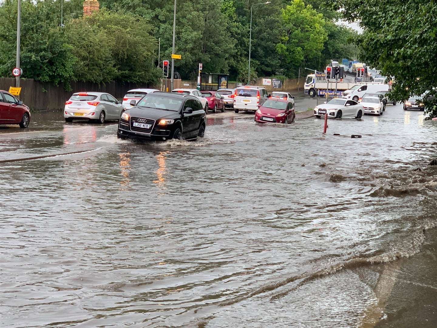 Flash floods at the A20 at the lights at Quarry Wood yesterday. Picture: Conrad Fry