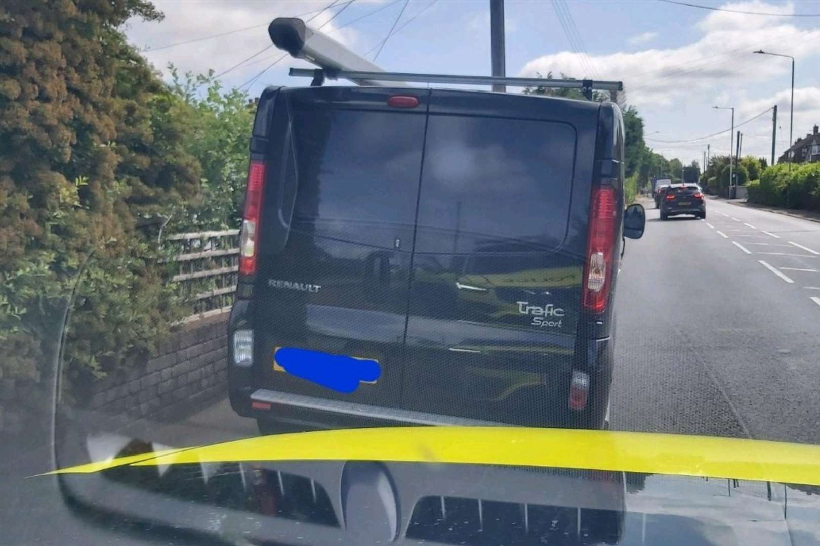A van driver was caught on his phone after driving past a marked police car. Picture: Kent Police RPU