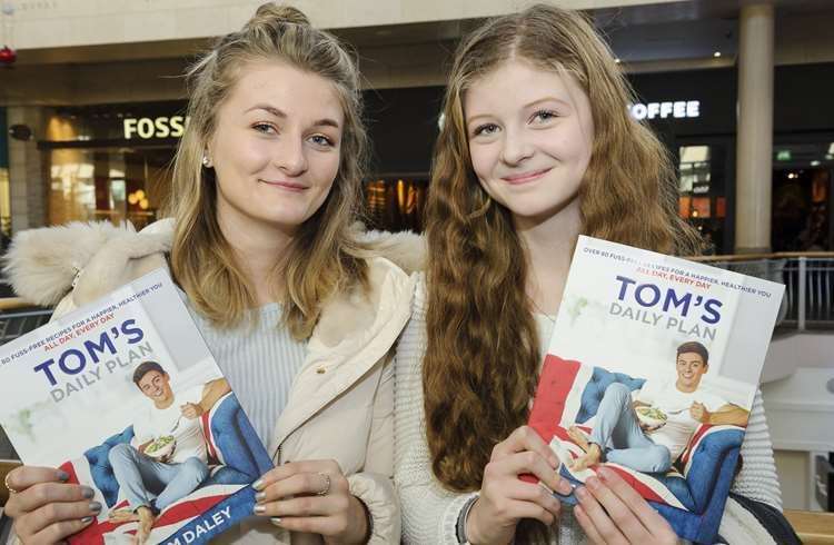 Lydia and Grace Broadley queued to have their books signed by Tom Daley